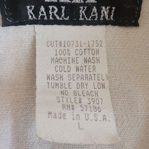 Vintage Karl Kani jeans vest, small with newspaper print.